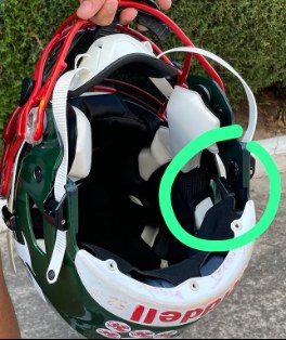 Inside an American football helmet, the sensor position circled