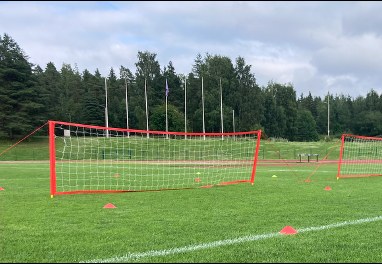 A training pitch set up with mini goals and marker cones